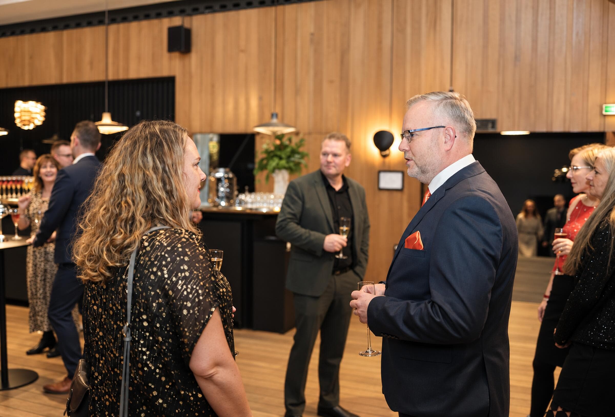 Executives in a focused peer conversation