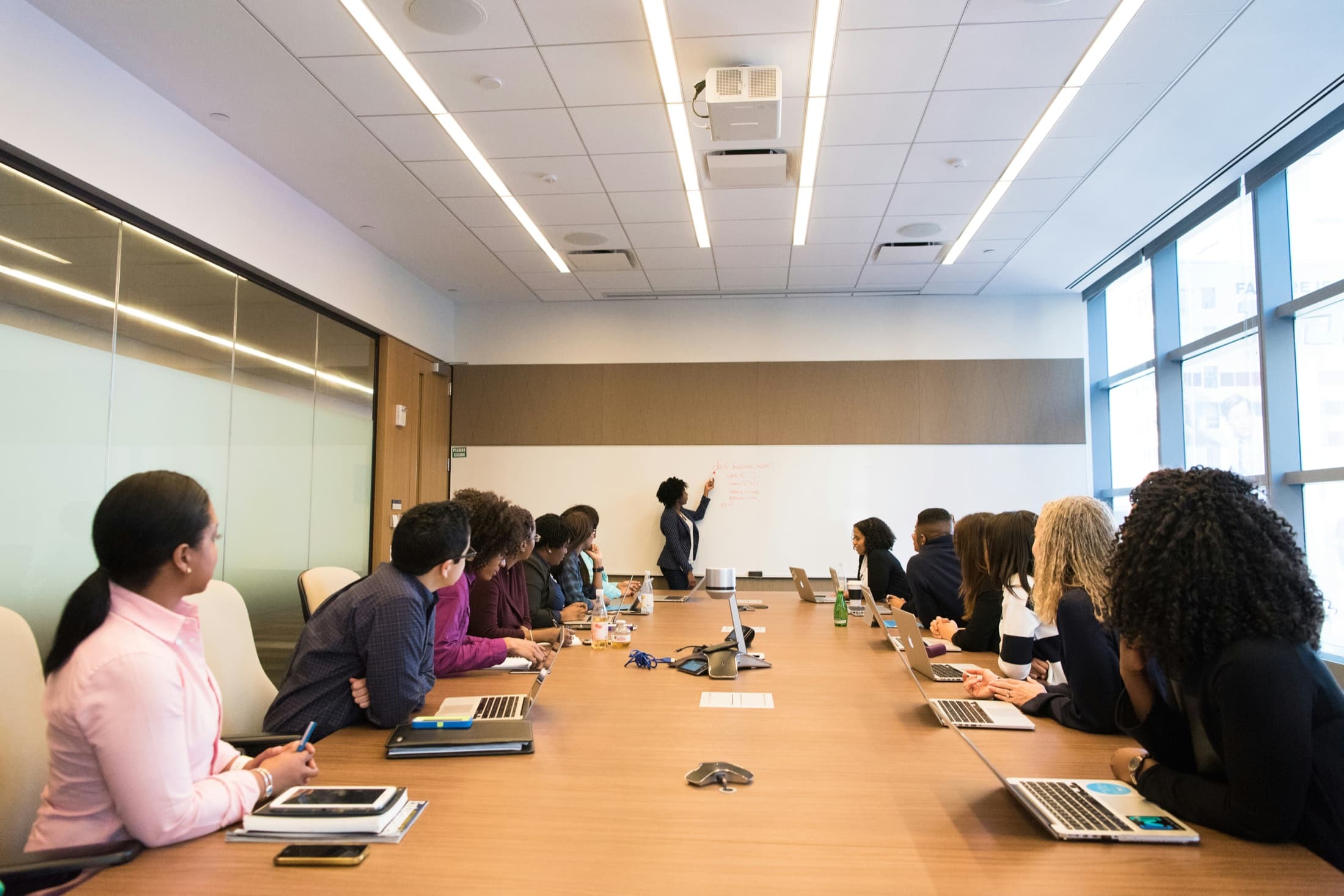 Executives taking part in a working session around a boardroom table