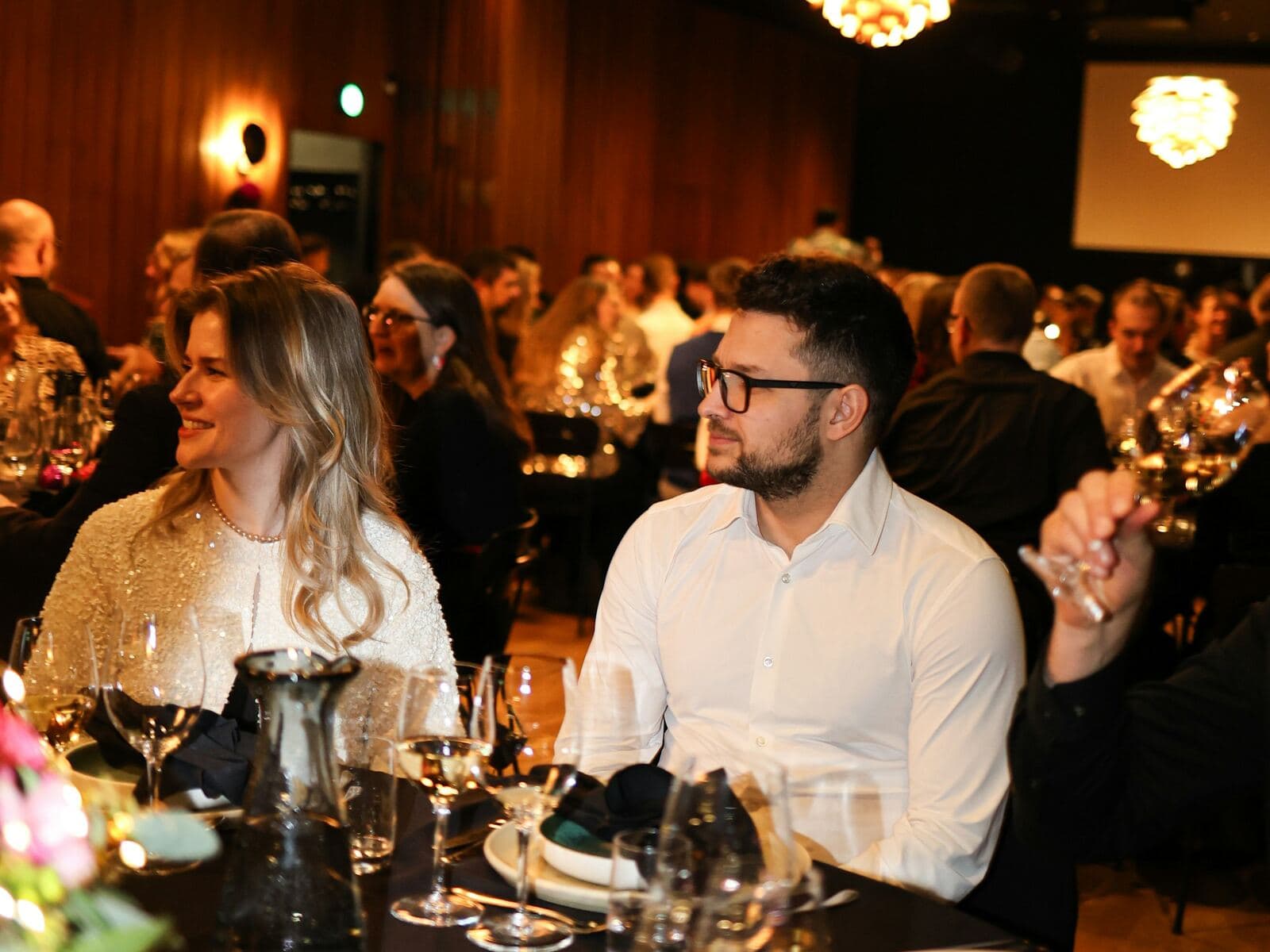 Members talking together during an elegant private dinner